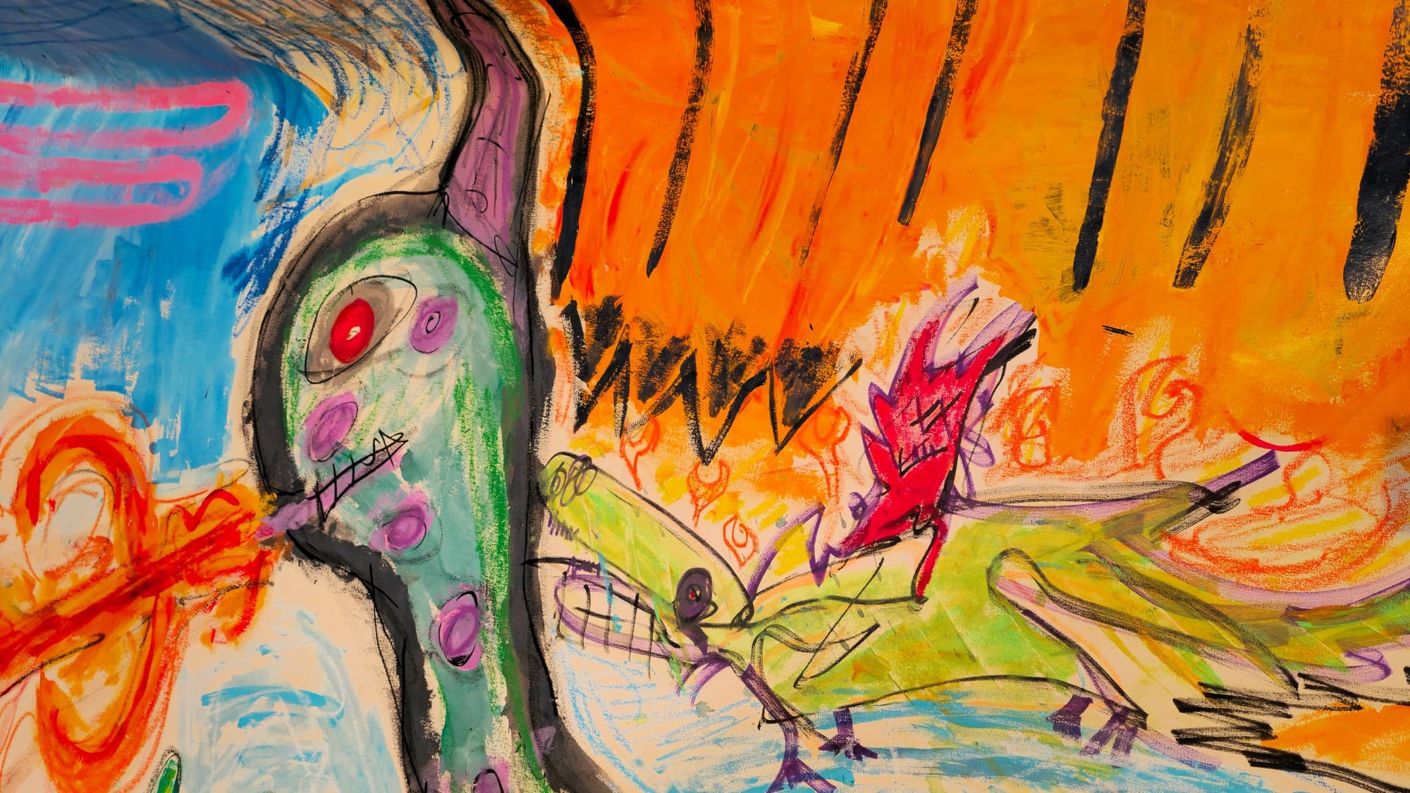 Close-up of the green creature's head in A Pack of Lips: a red eye ringed in grey, a purple horn-cap, a stitched grin, and a red beam entering the mouth from an orange double-coil; on the creature's back a small green crocodile carries a red imp through hand-drawn orange flames, under an orange curtain barred with black.