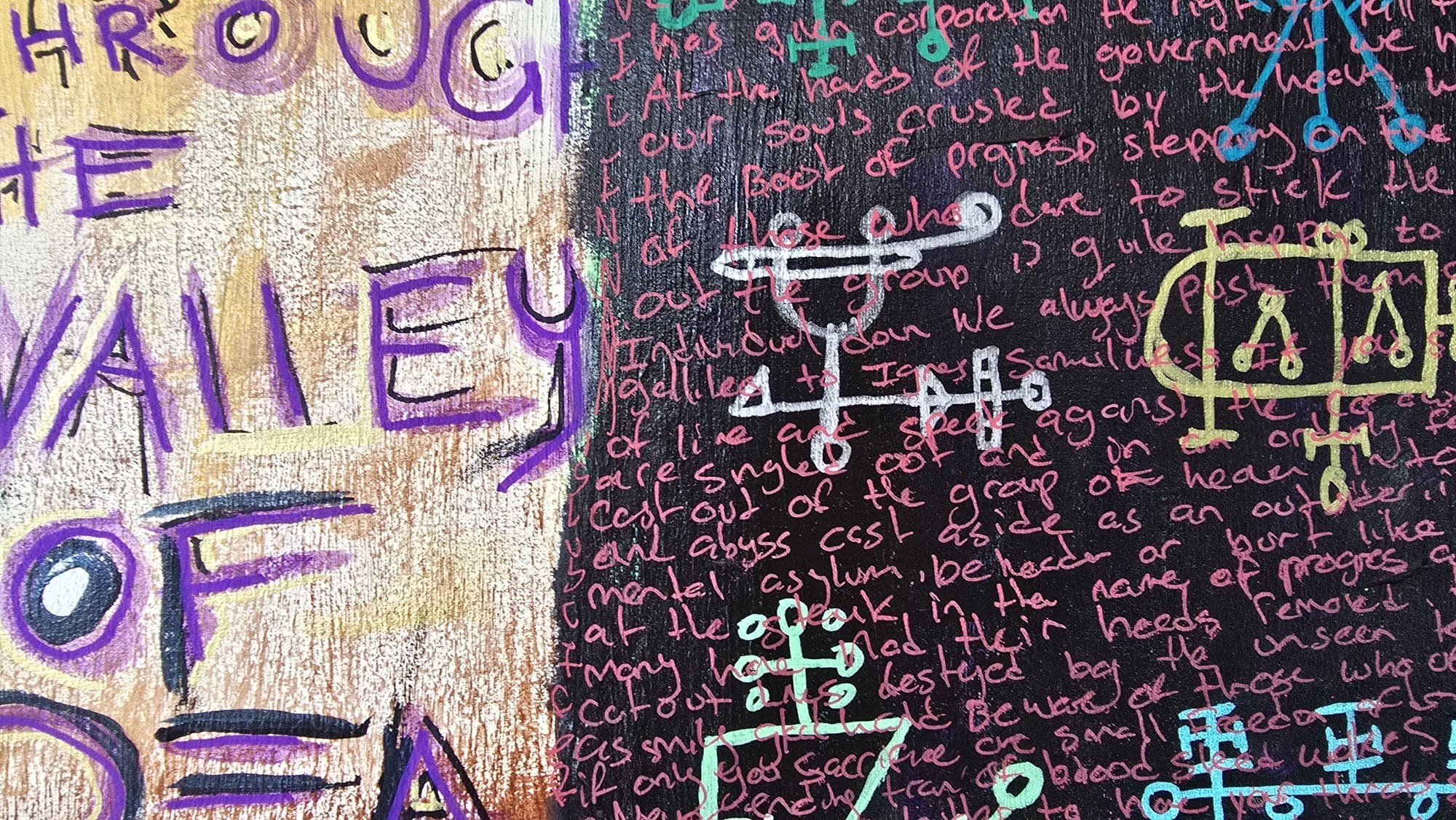 Close-up of WHEN I WALK THROUGH THE VALLEY OF DEATH spelled in purple crayon next to a dark panel of dense pink handwritten prose and alchemical sigils.