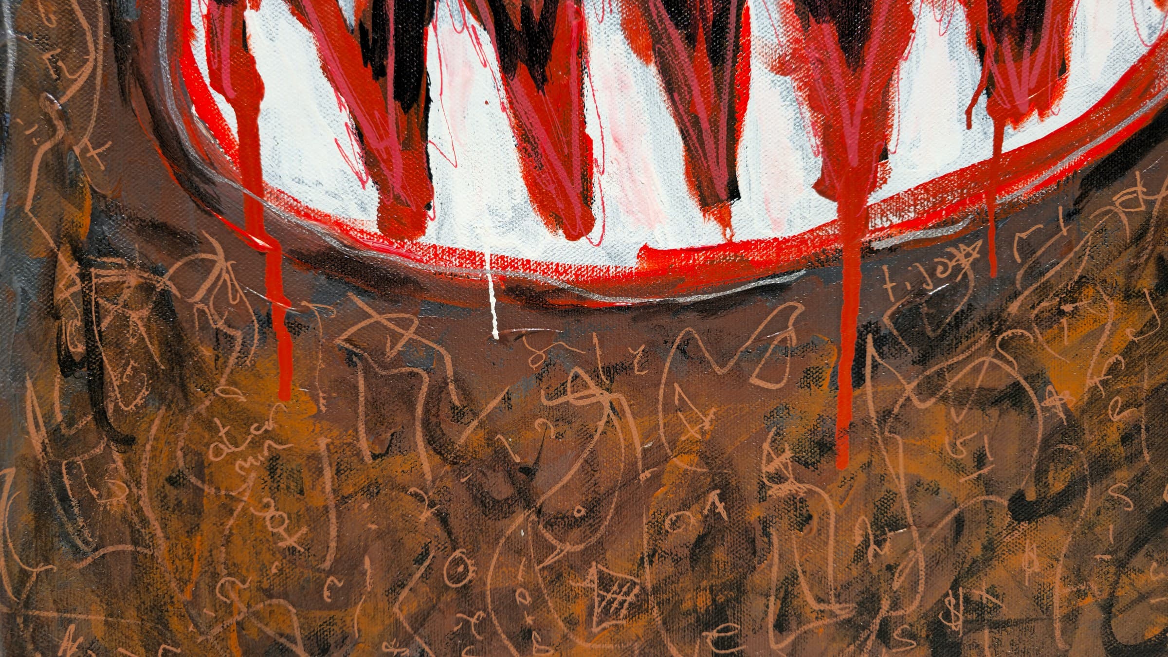 Close-up of the grin of Feral Freq: a wide white mouth full of jagged red and black zigzag teeth outlined in red, with thin red paint dripping down past the jaw over the brown lower body, which is covered in pale paint-pen scrawl.